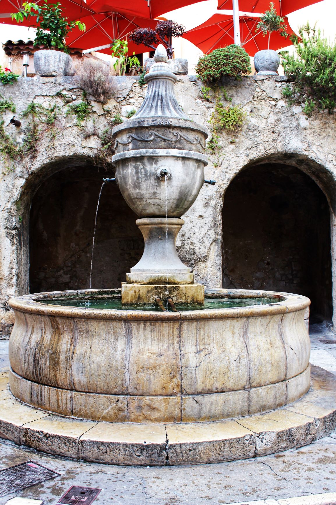 ancient stone water fountain in france