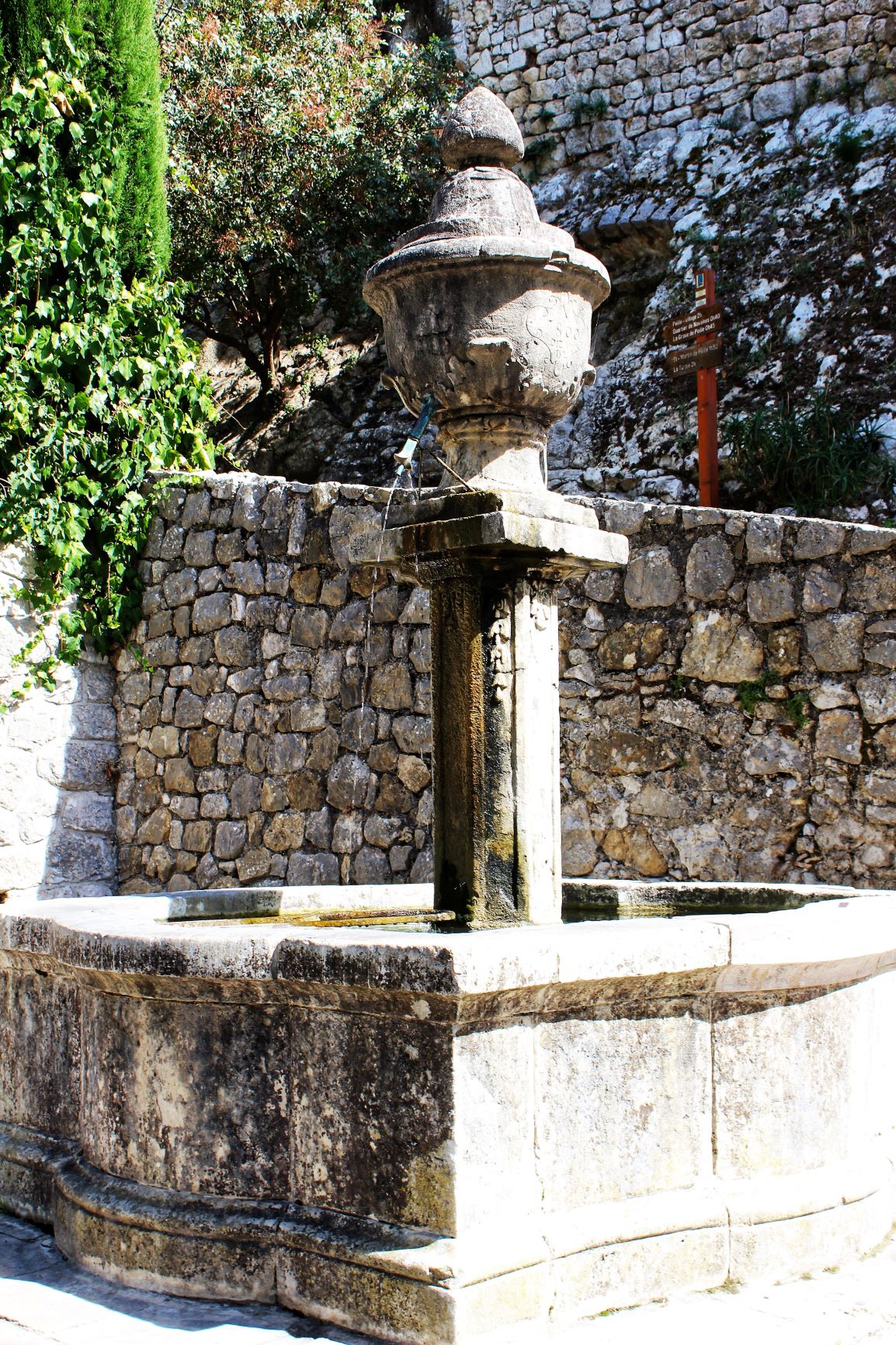 stone ancient water fountain in france