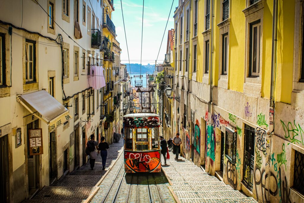 funicular in red up a hill in lisbon