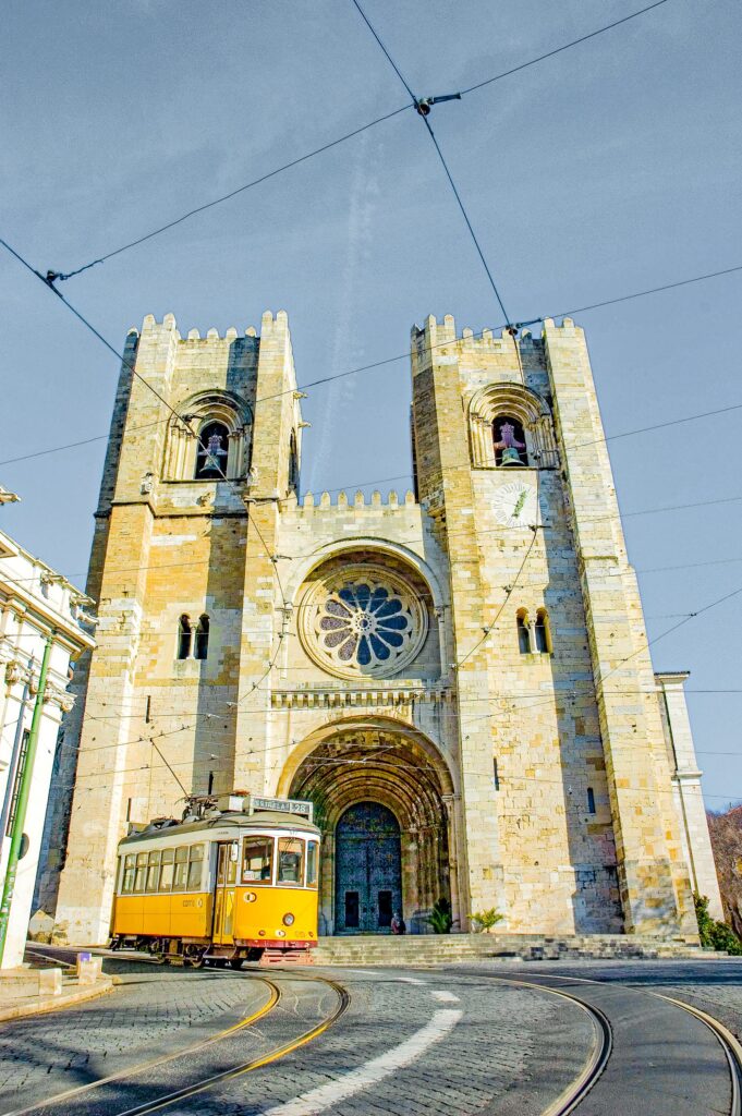 church with yellow tram in lisbon itinerary 4 days
