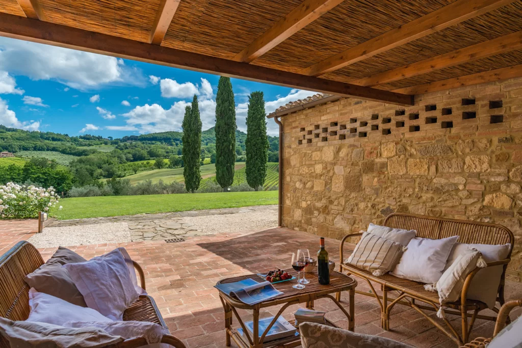 outdoor seating with countryside view from hotel in montepulciano
