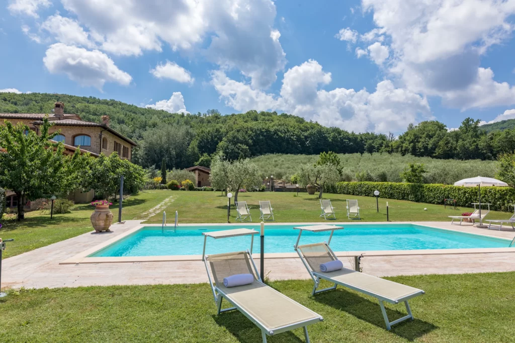 pool with lounge chairs in one of the best places to stay in montepulciano