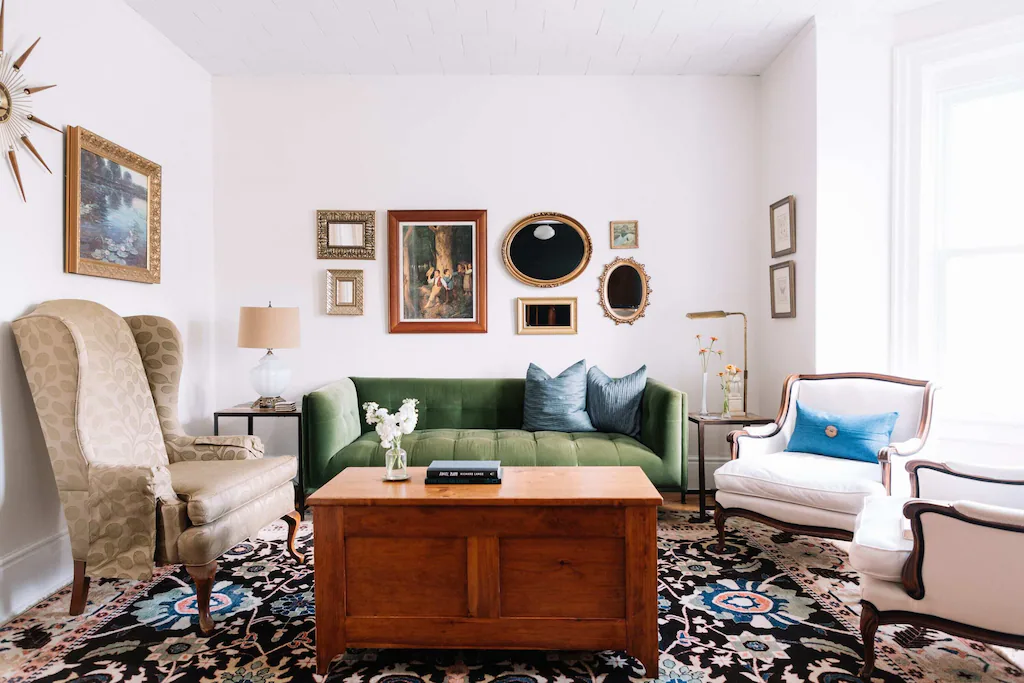 living space with sofa, arm chair with photo on wall in airbnb in prince edward county
