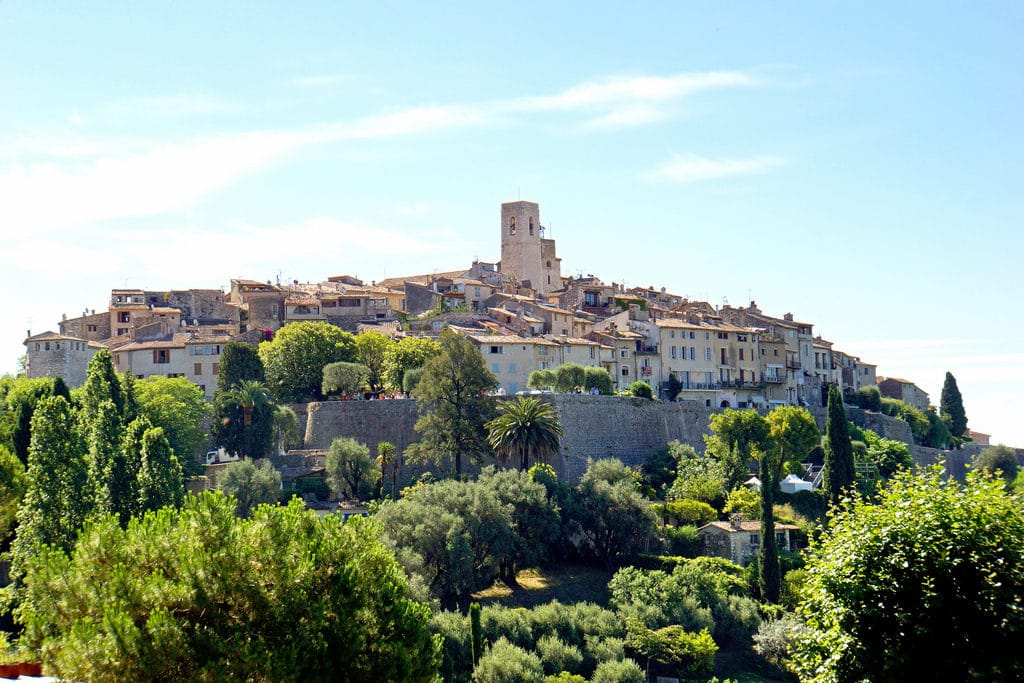 perched on hill stone village with greenery as one of the villages near Nice