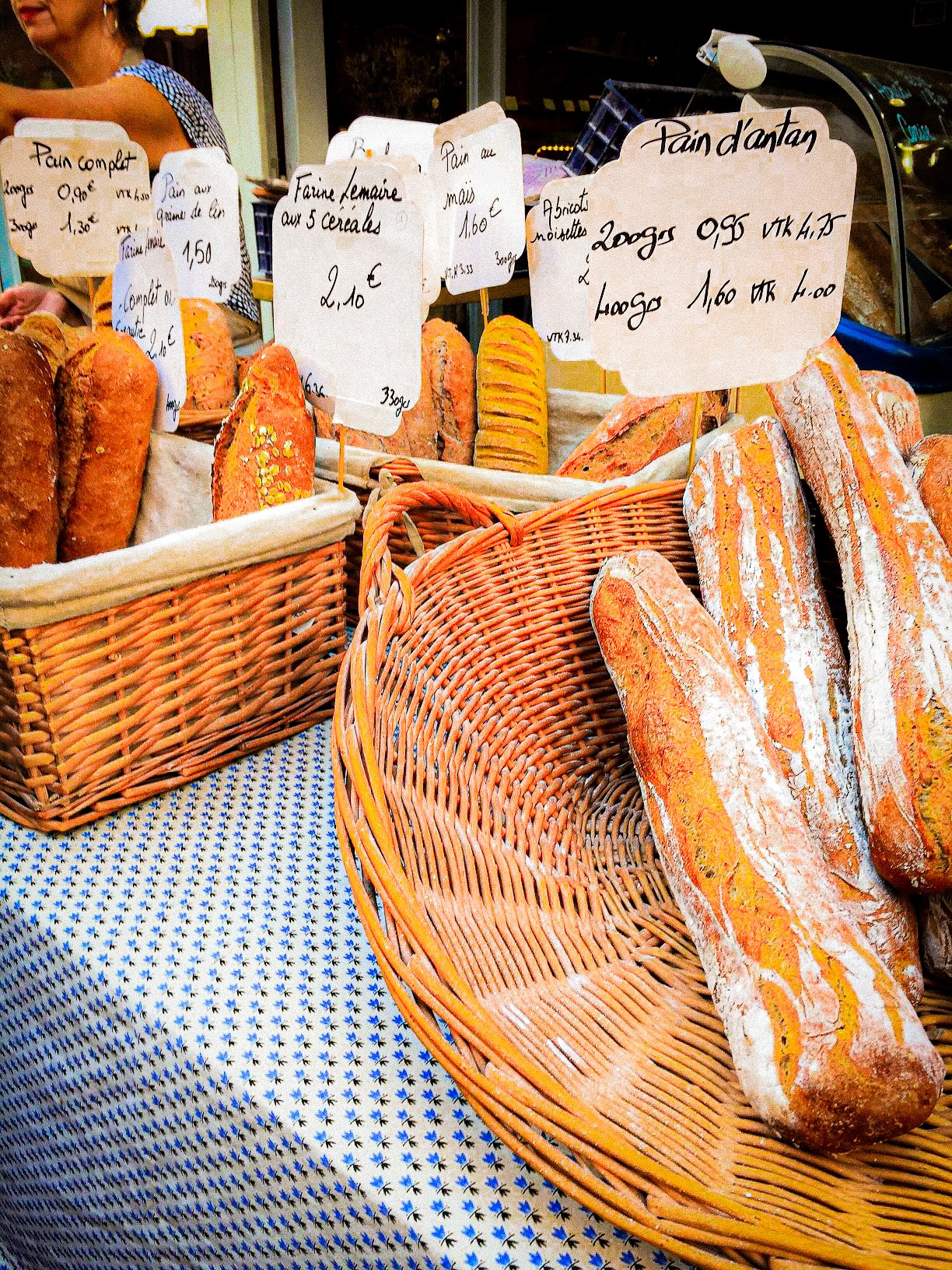 bread loaves, baguettes in market stall