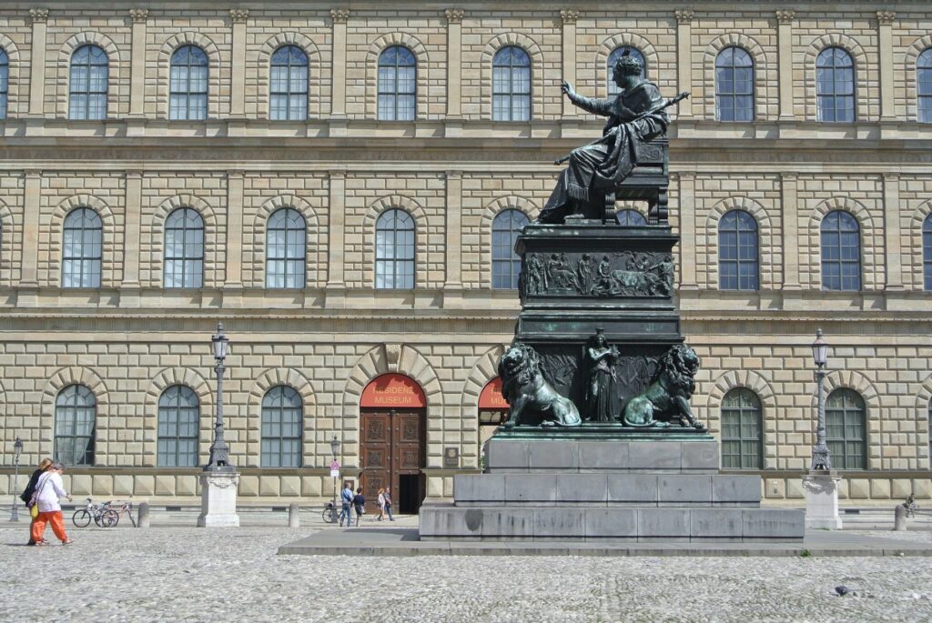building with bronze statue