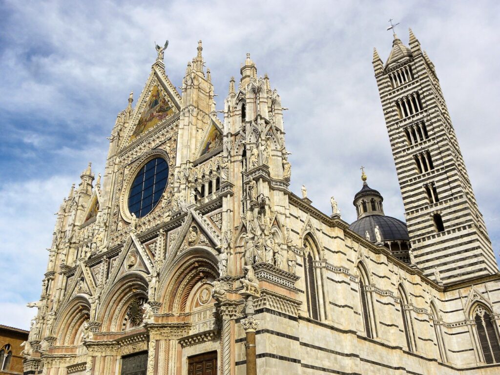 Siena is a medieval walled city in Tuscany Italy. The best places to visit in Siena are Piazza del Campo, Siena Cathedral, historic city centre with its winding alleyways from the middle ages.