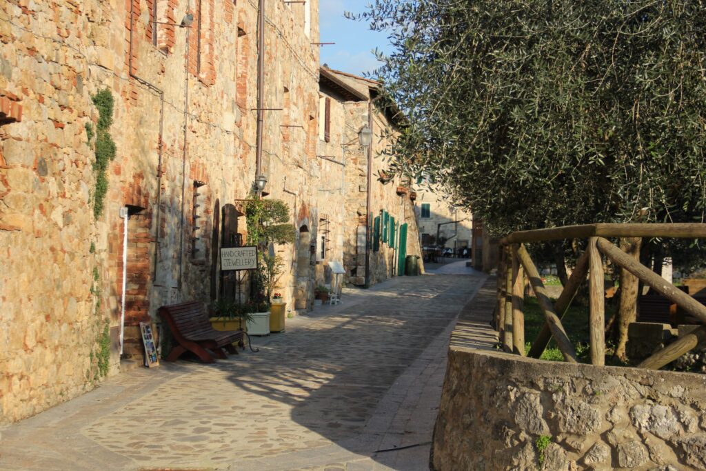 stone village with olive tree in one of the most beautiful towns to visit in tuscany 