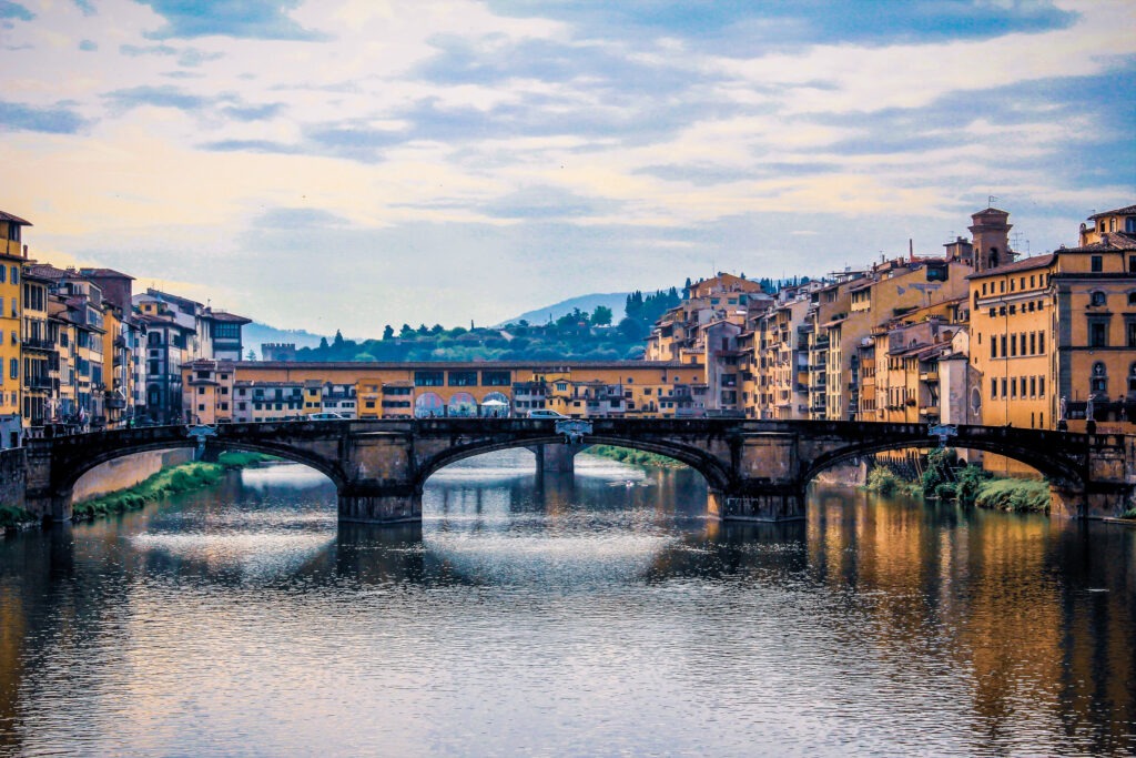 bridge with colourful buildings in the capity city of tuscany - florence