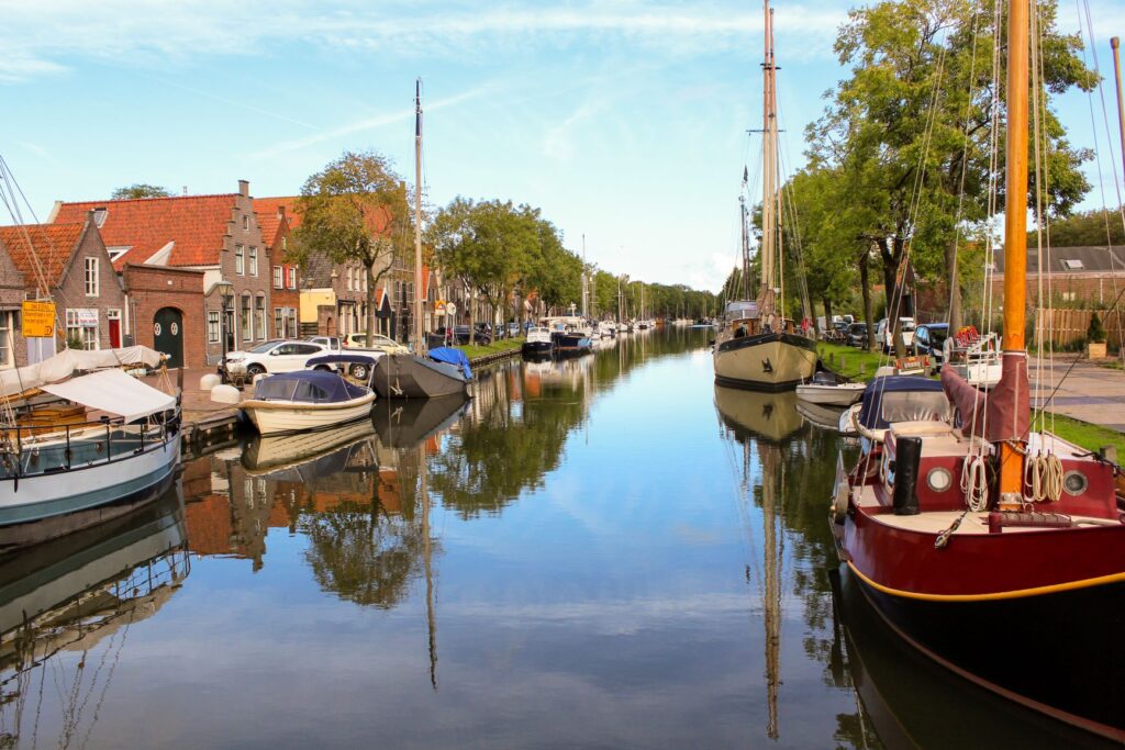canal with boats amsterdam countryside in netherlands