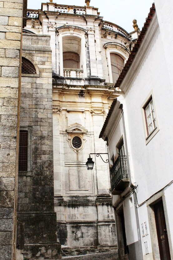 ancient cobblestone street and building in evora portugal