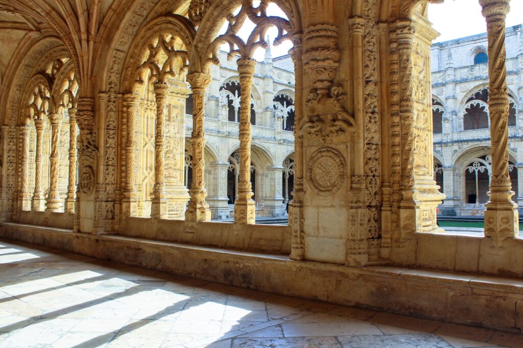 Jeronimos Monastery Lisbon with light pouring through the archways