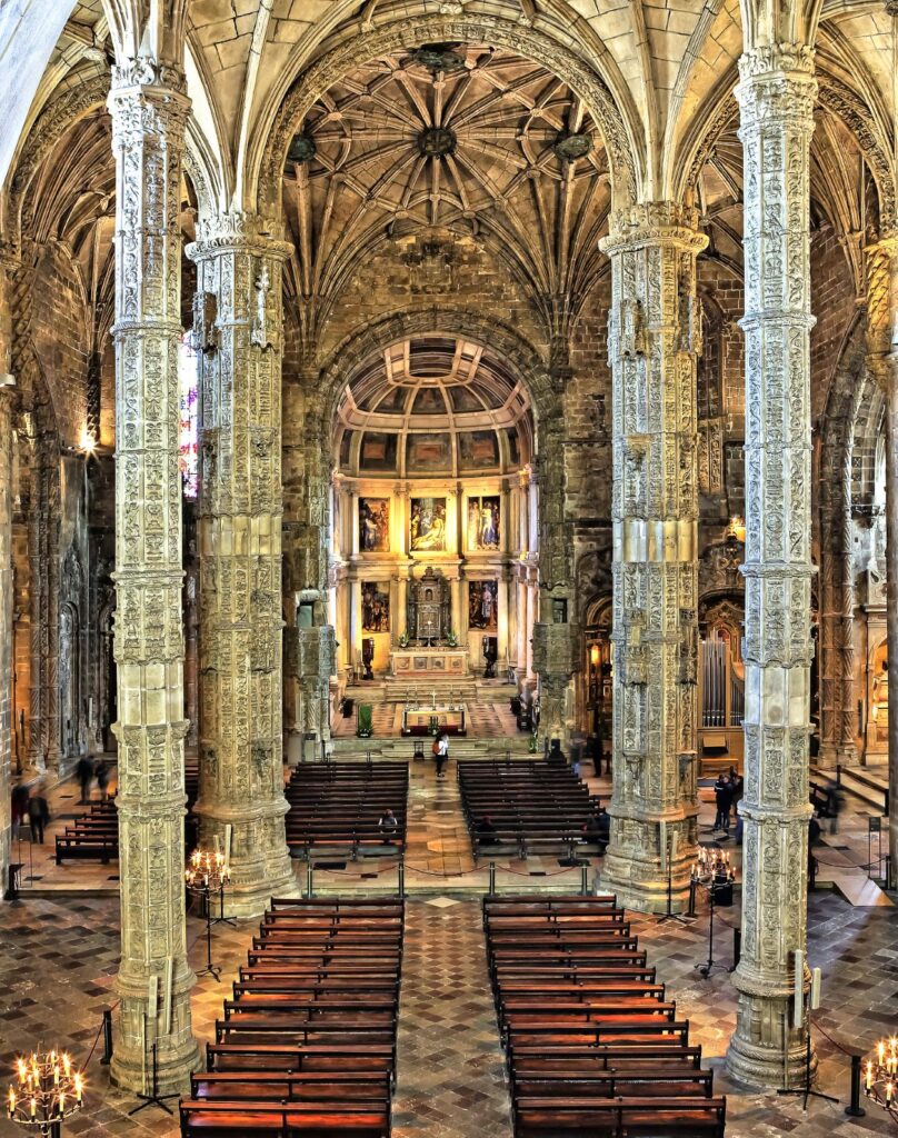 cathedral with soaring stone pillars in Jerónimos Monastery in Lisbon Portugal