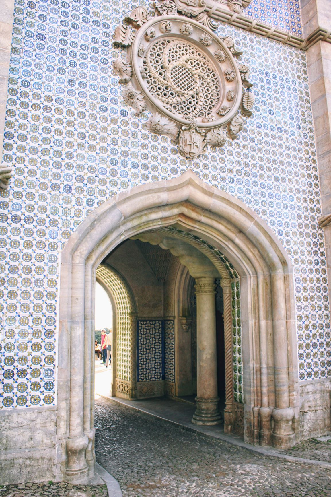 blue tile wall and stone archway at pena palace sintra
