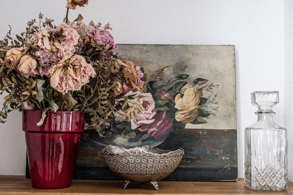 dried roses, painting antique decanter in apartment in Paris