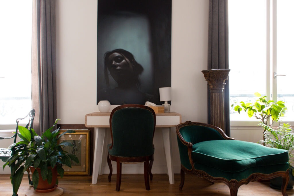 desk, chair and artwork in Paris apartment rental in Le Marais