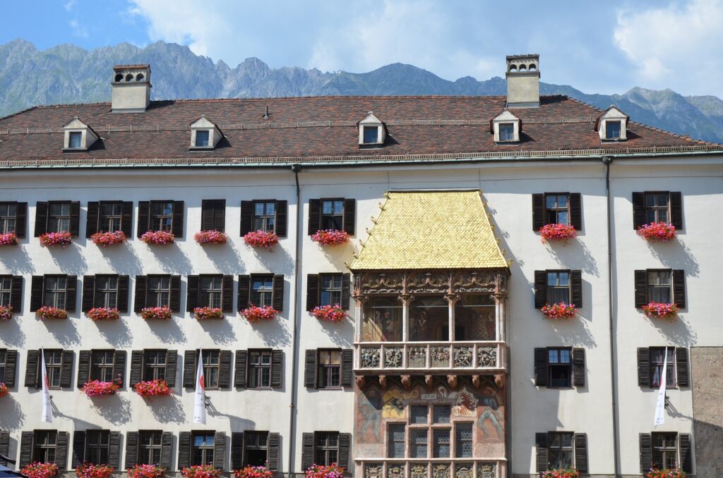 building with golden roof with mountains in innsbruck in one day