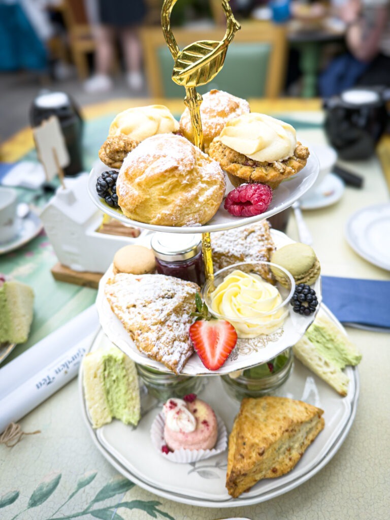 tea 3 tier tray caddy with baked goods on a table at the watering can near jordan village in ontario