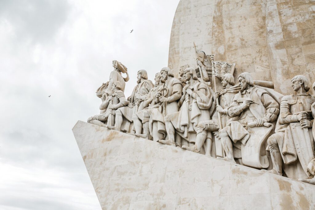 stone monument with carvings of explorers in lisbon