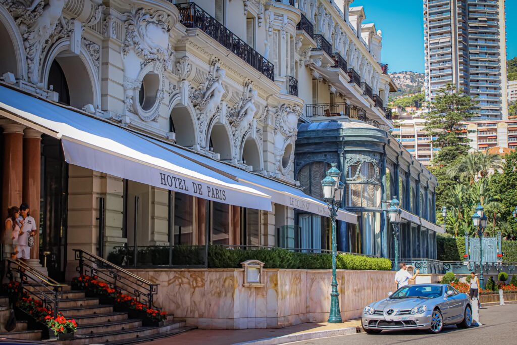 hotel with awning, car pulled in front in monaco
