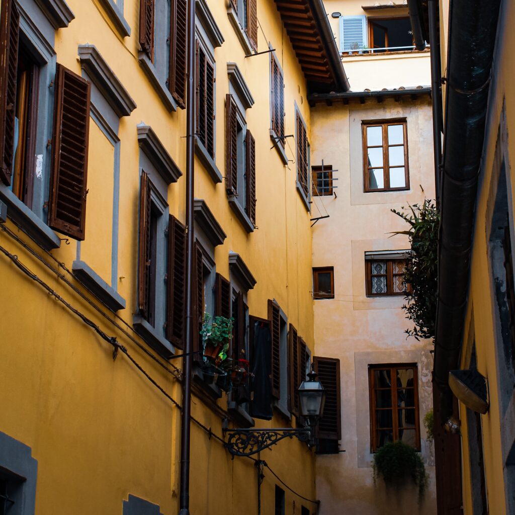 buildings in florence italy with shutters and lantern