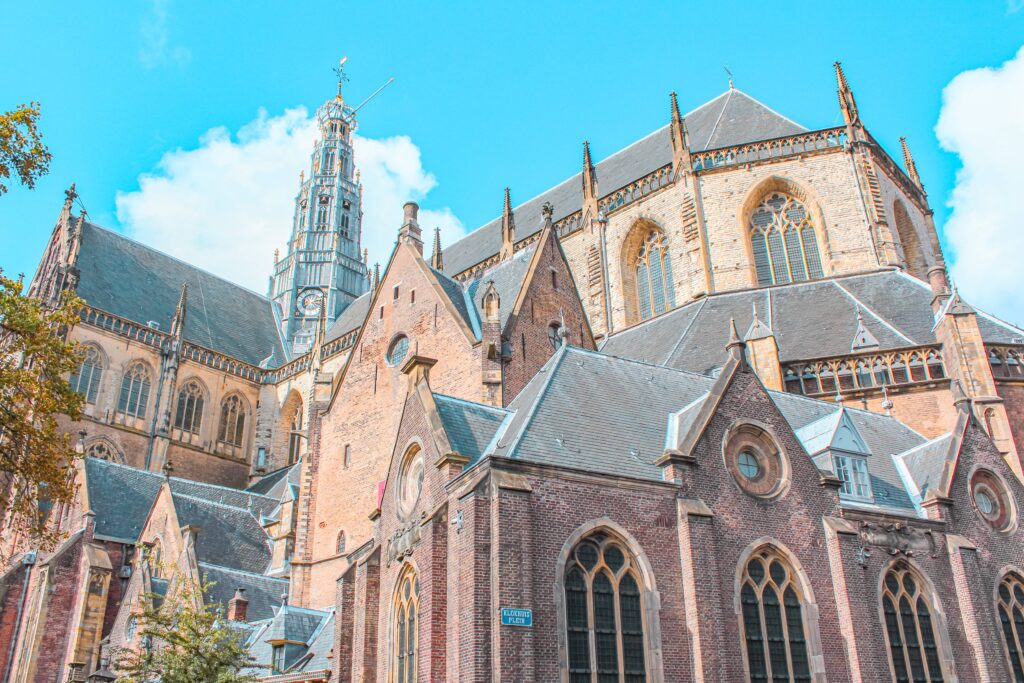 chuch with clock tower and tree on haarlem day trip