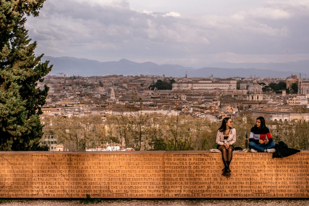 brick wall with view of rome from rome gardens
