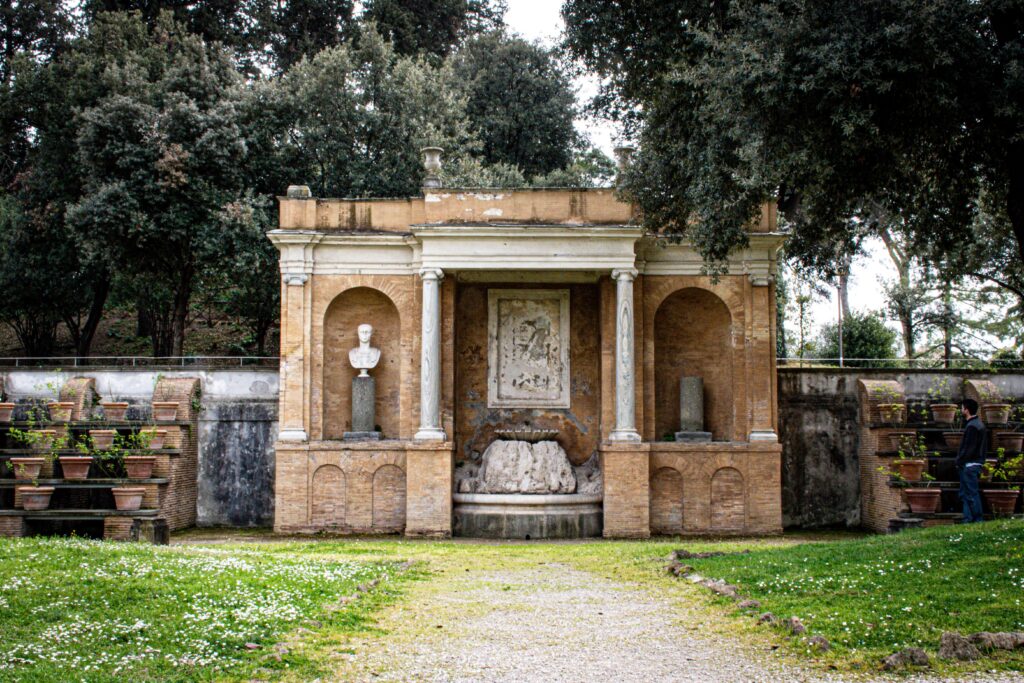 ruin in rome gardens with trees in coppede neighbourhood