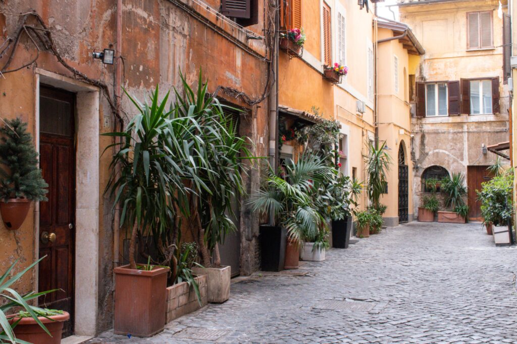 cobbled street, plants and colourful buildings in rome how many days