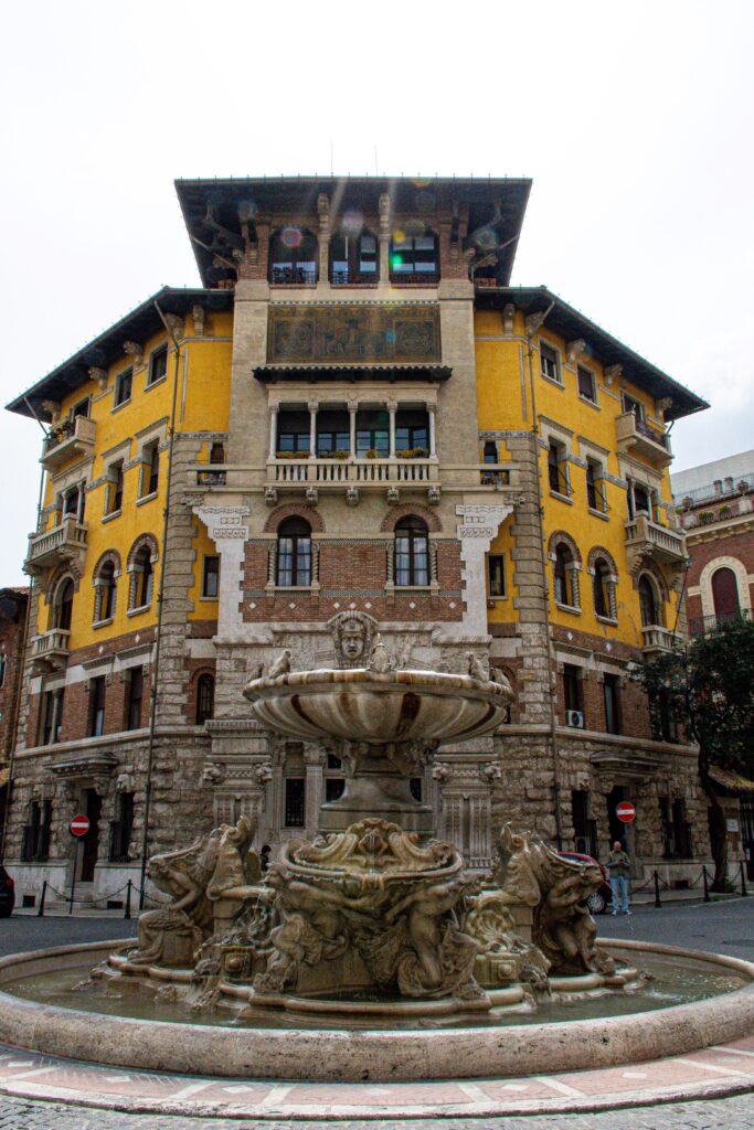 building with fountain in quartiere coppede neighbourhood in rome