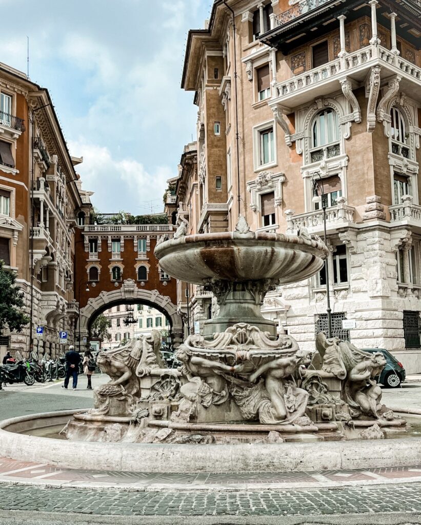 fountain with arch in rome's quartiere coppede neighbourhood