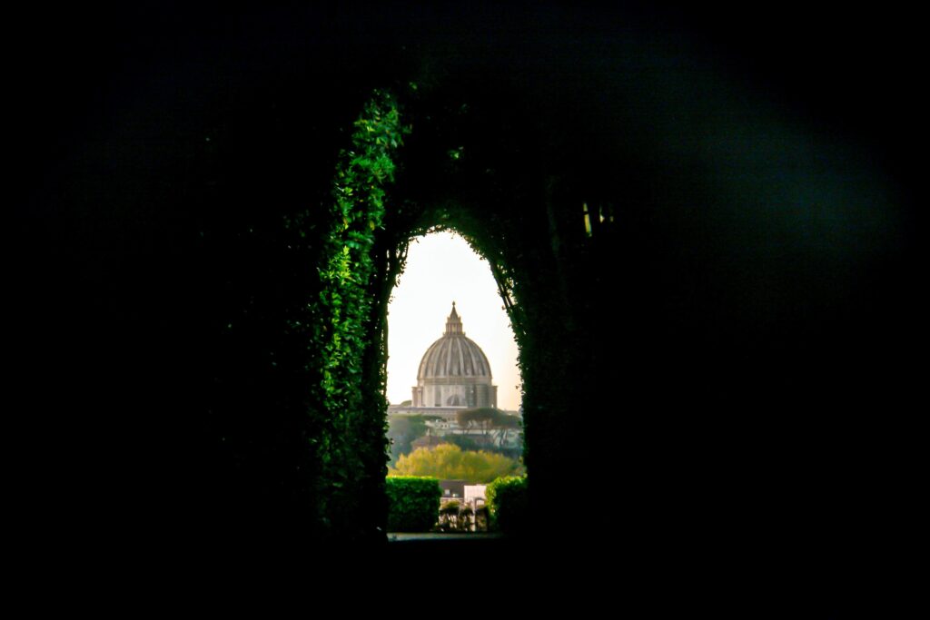 key hole with view of church dome in streets of rome
