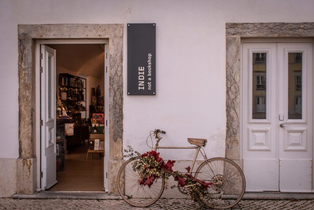 store with bike and sign from lisbon to cascais