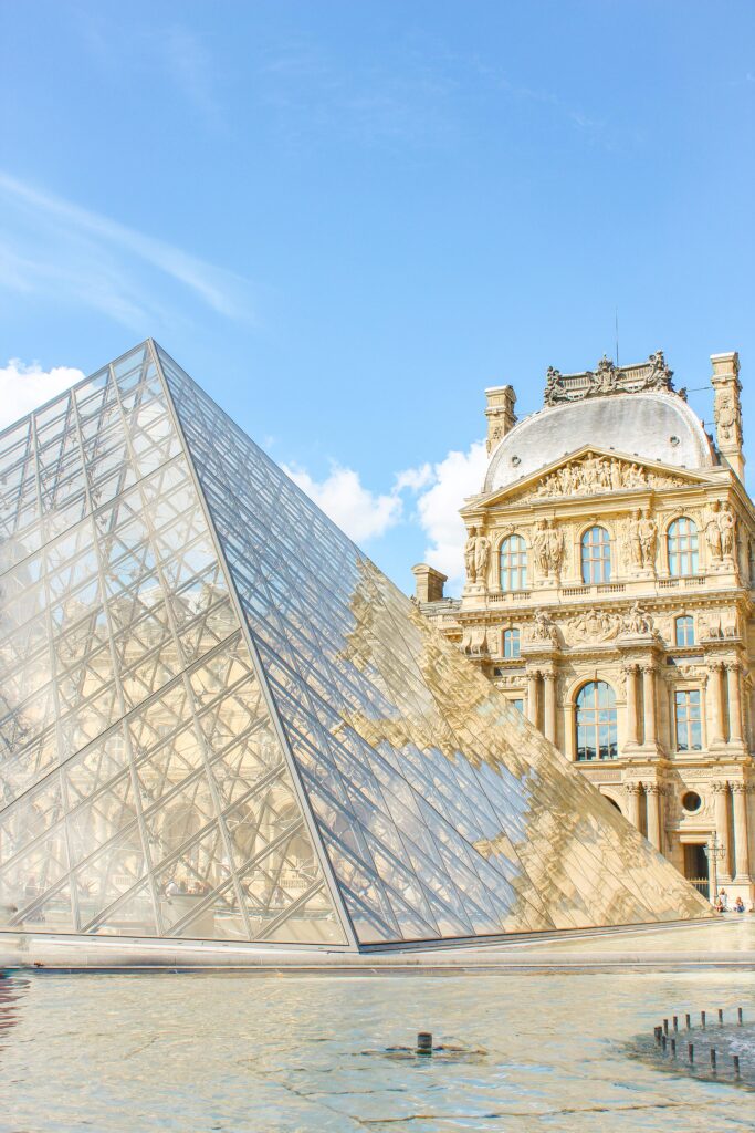 glass triangle with building in paris for a weekend