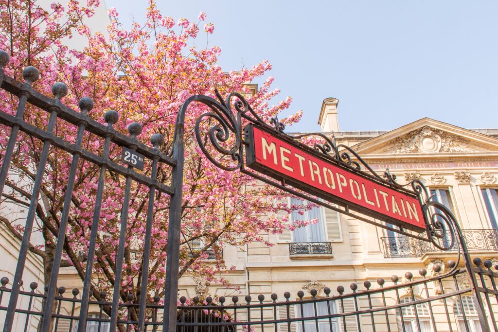 metro sign with pink flowers in paris