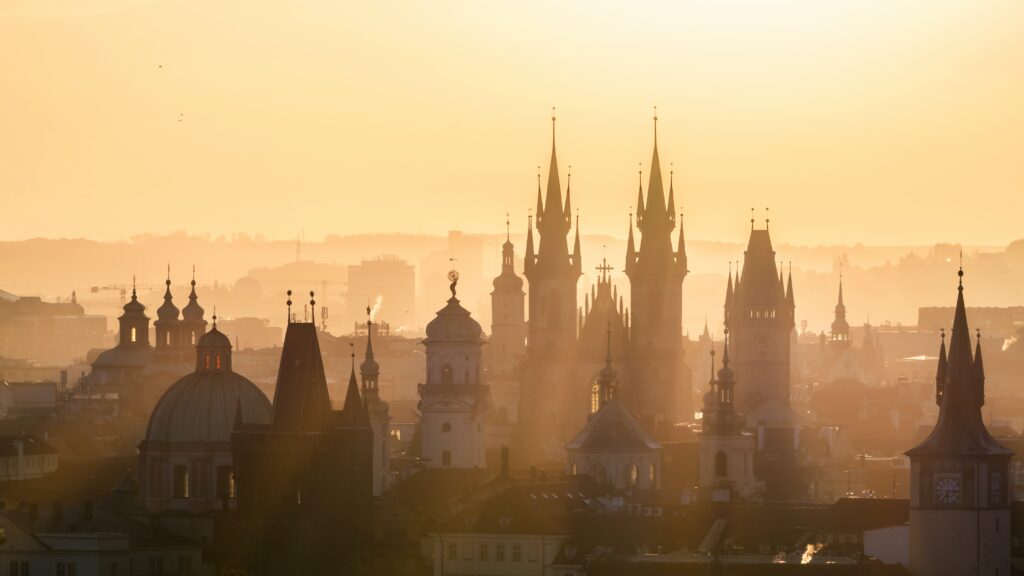 sun light with spires from buildings in Czech Republic travel