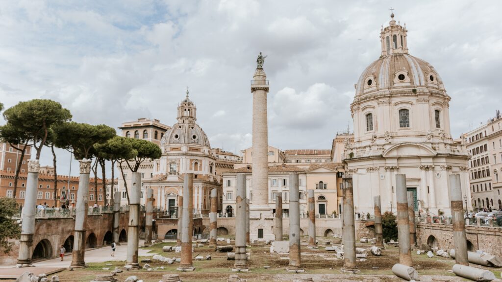 roman ruins with church in italy travel
