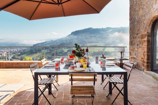 table and chairs on terrace in orvieto italy getaways