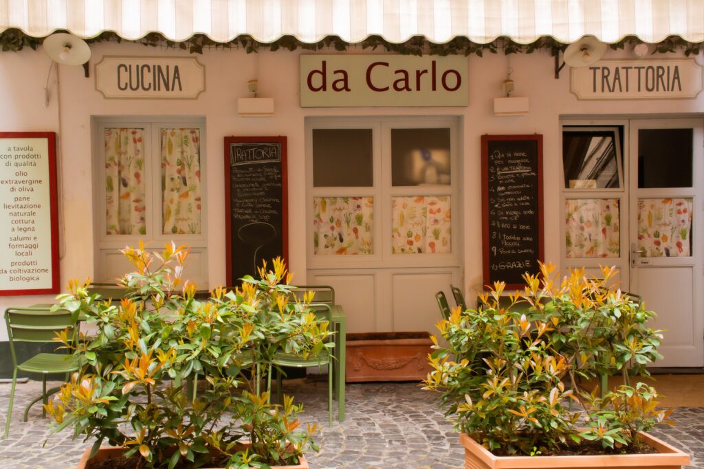 restaurant in orvieto italy with awning and menu boards on orvieto day trip from rome
