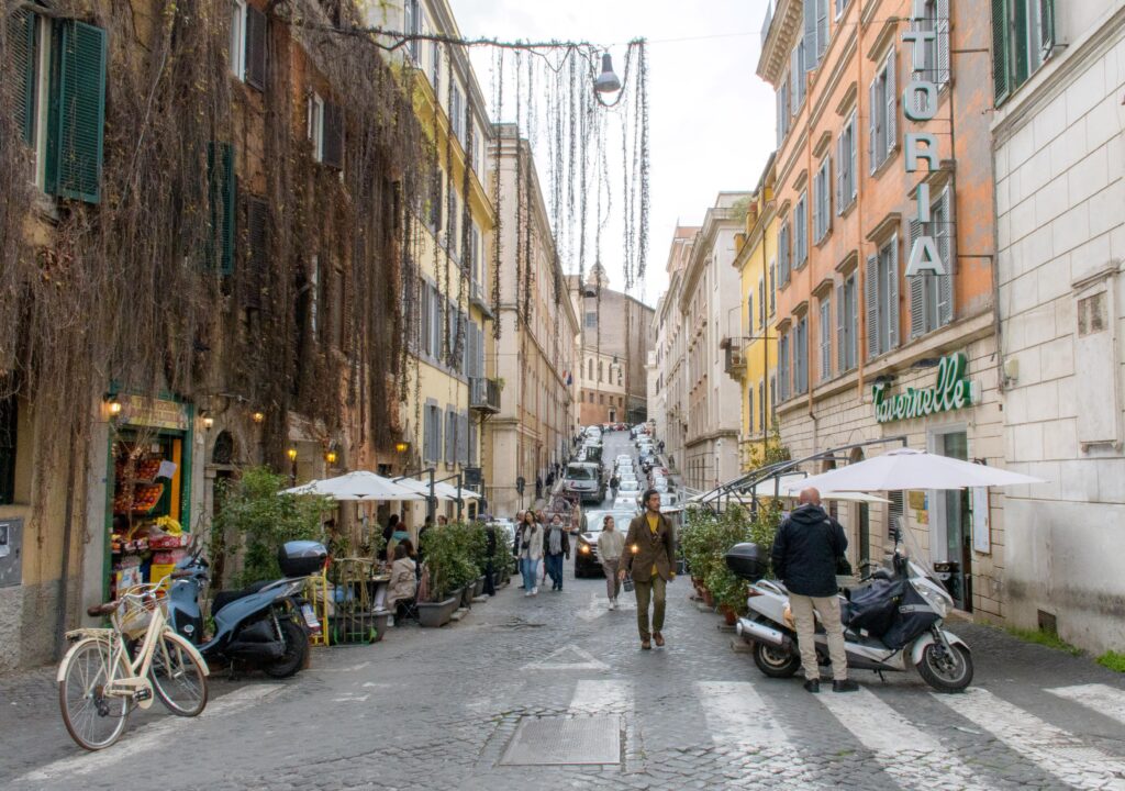 street in rome with buildings, vines hanging 