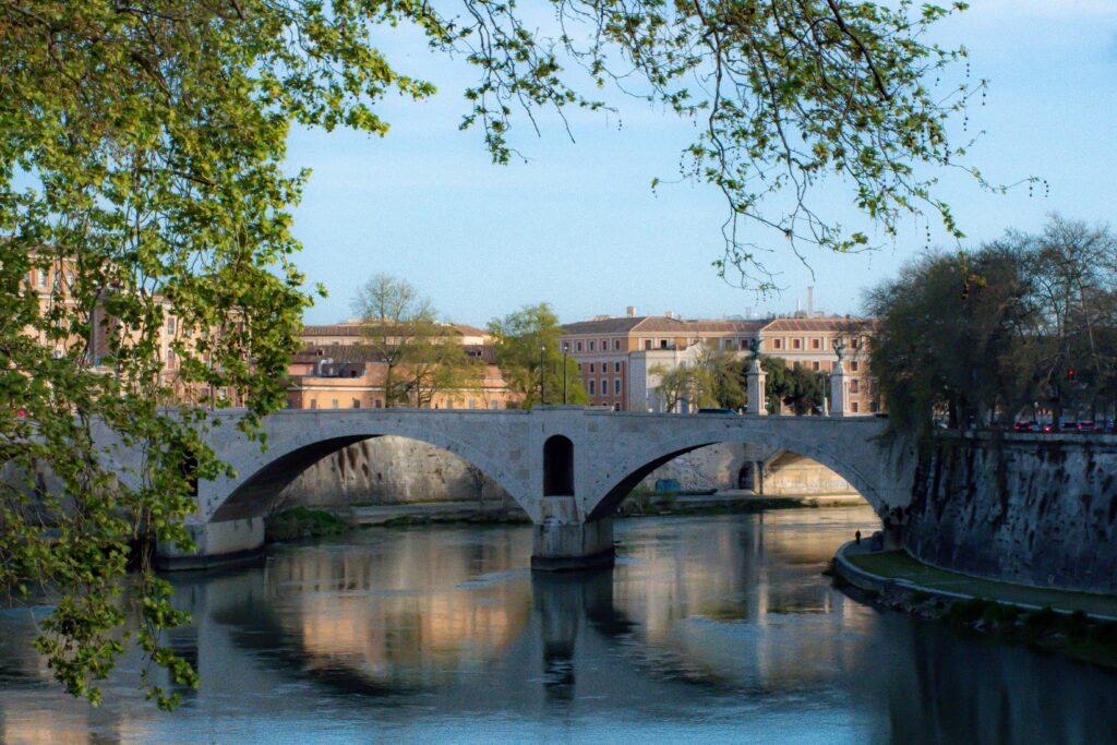 river with bridge and reflection on visit to rome