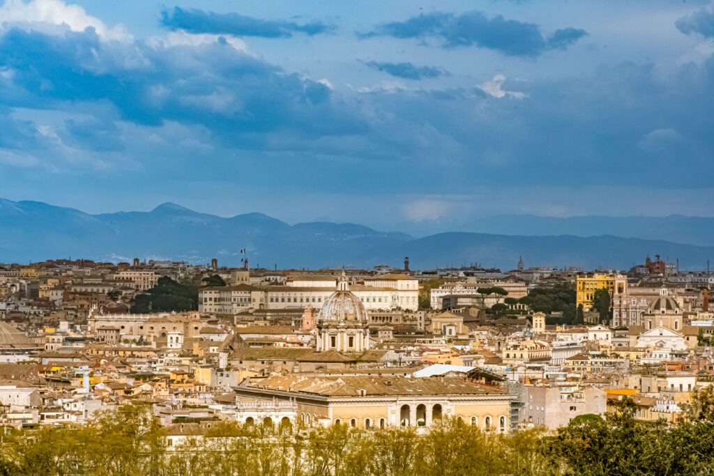 skyline view of rome with dark clouds when visiting rome