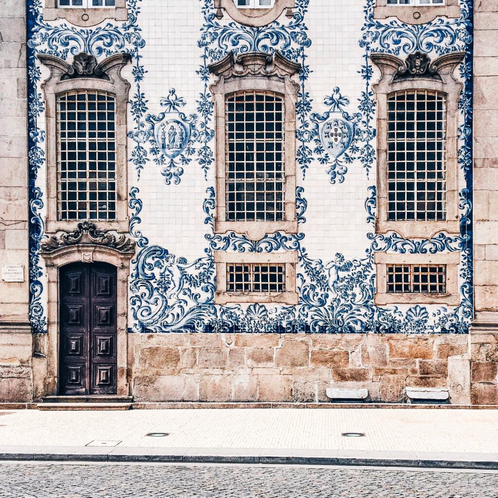 blue and white tiles on side of church in porto