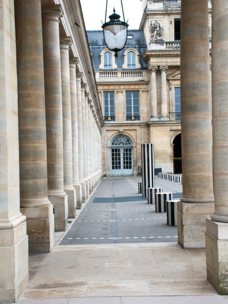 stone pillars, latern with windows on plan trip to paris