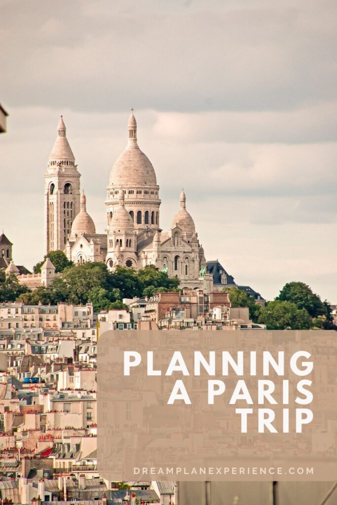 city rooftops and church on hill when planning a paris trip