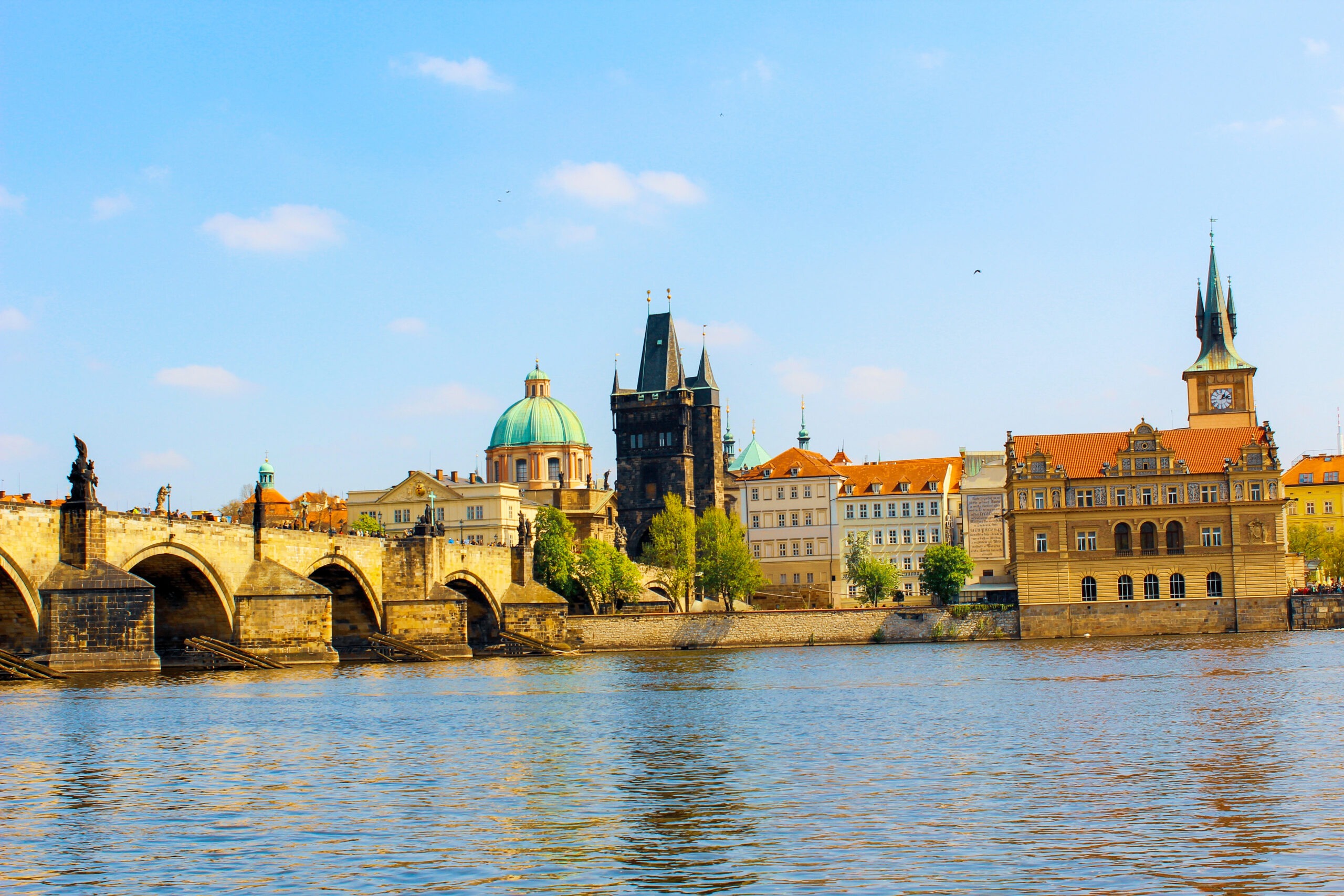 water with bridge and tower on a prague boat trips