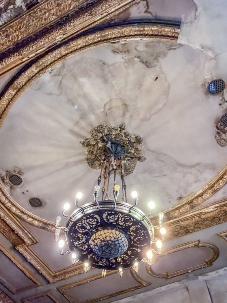 marble ceiling with chandelier in traditional german restaurant berlin