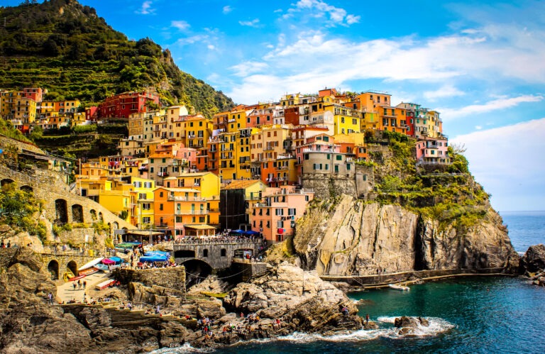 colourful villages on cliff by sea on cinque terre boat tour