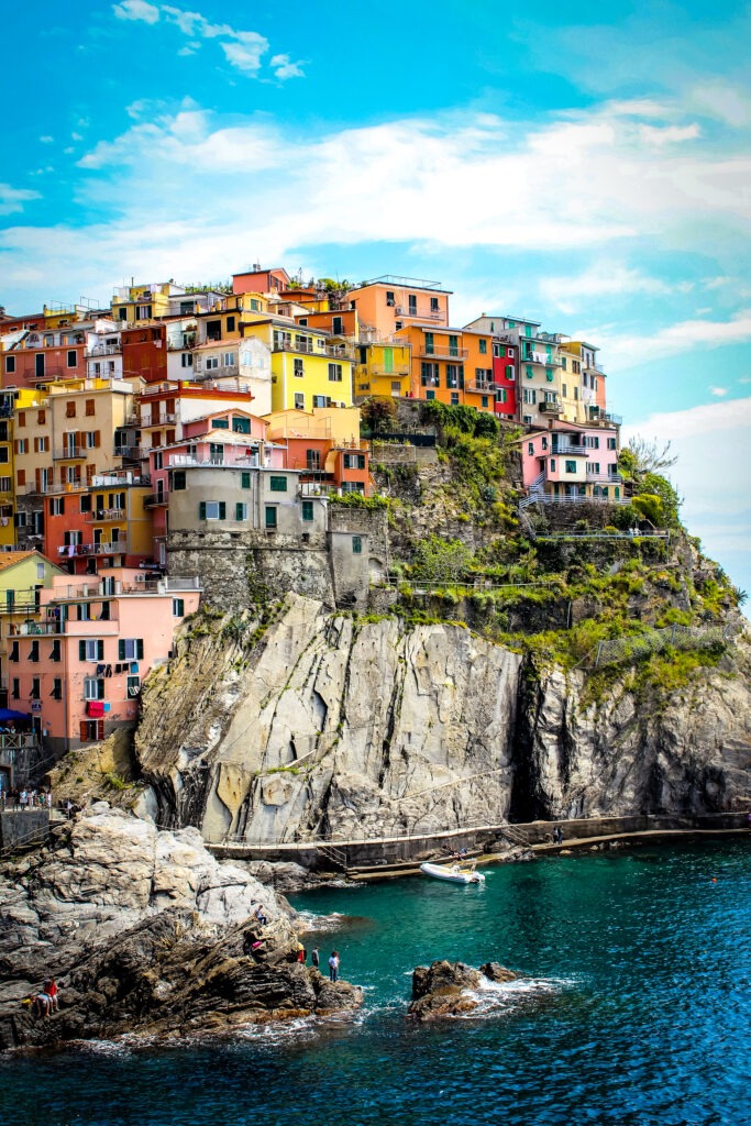 colourful houses on cliff with sea on cinque terre from florence day trip