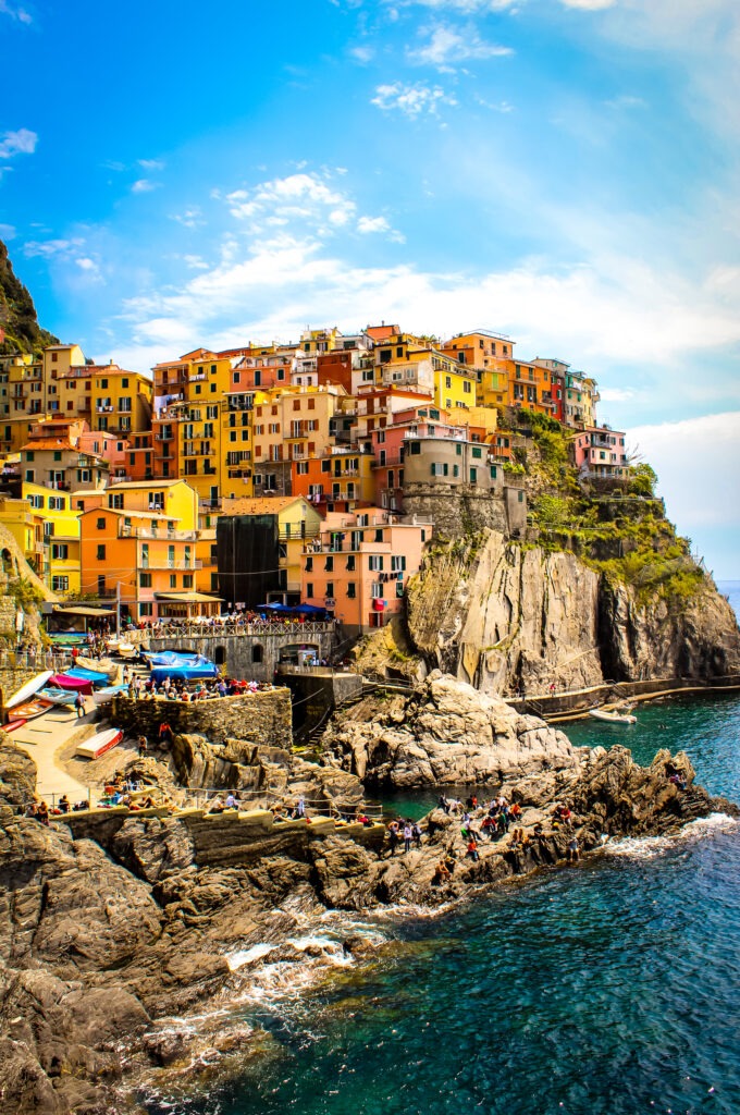 colourful houses perched on cliff on tour from florence to cinque terre